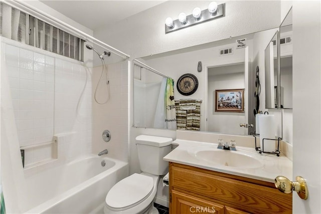 full bathroom with vanity, toilet, and shower / tub combo