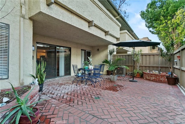 view of patio featuring fence