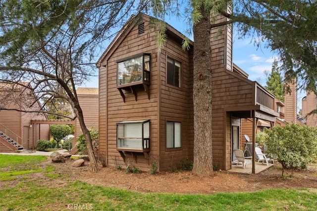 rear view of property with a patio area