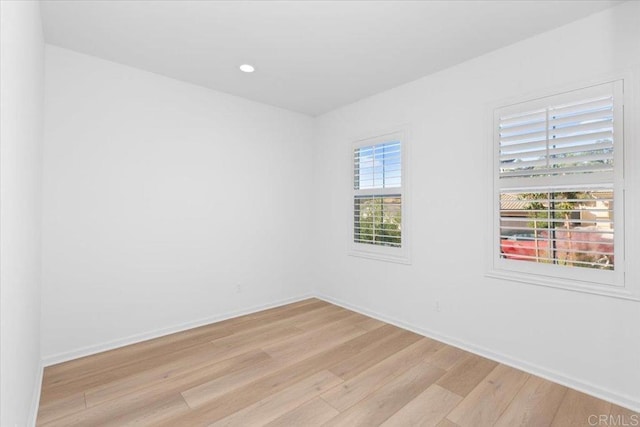 unfurnished room featuring light hardwood / wood-style flooring