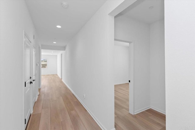 corridor featuring light wood-type flooring