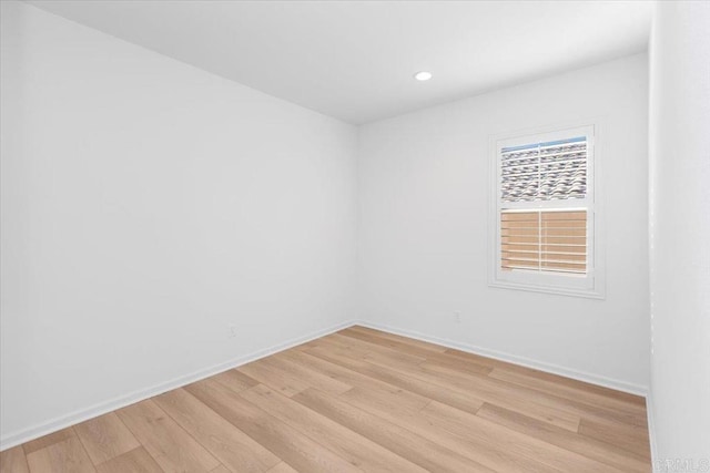 spare room featuring light hardwood / wood-style flooring