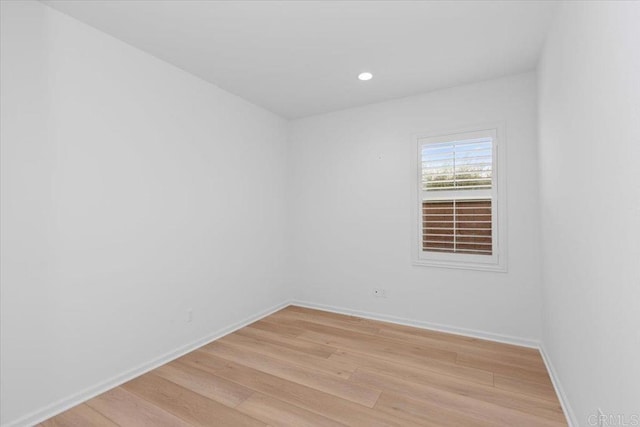 spare room featuring light hardwood / wood-style floors