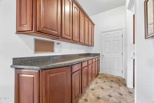 kitchen with dark stone countertops