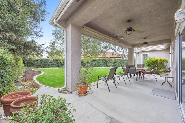 view of patio featuring ceiling fan