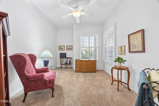 sitting room with light carpet and ceiling fan