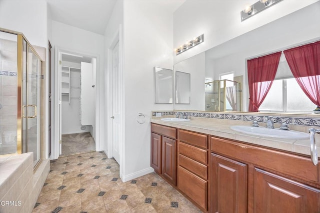 bathroom featuring vanity and a shower with door