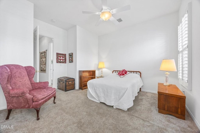 bedroom with ceiling fan and light colored carpet