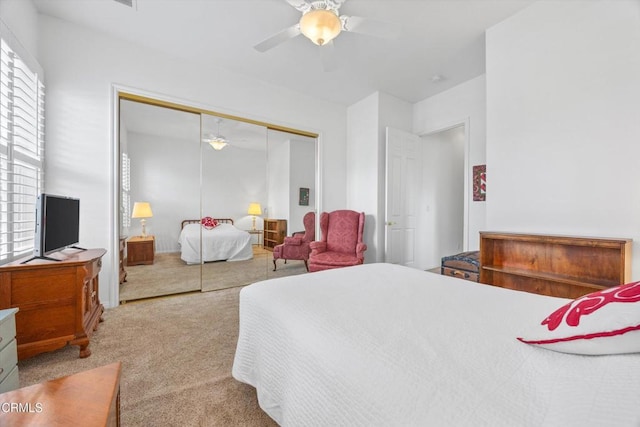 bedroom featuring carpet floors, a closet, and ceiling fan