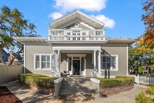 neoclassical home with a balcony