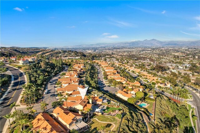 birds eye view of property featuring a mountain view