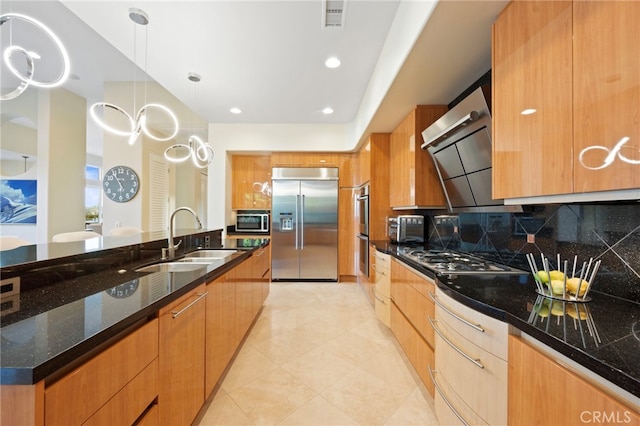 kitchen with modern cabinets, appliances with stainless steel finishes, a sink, and visible vents