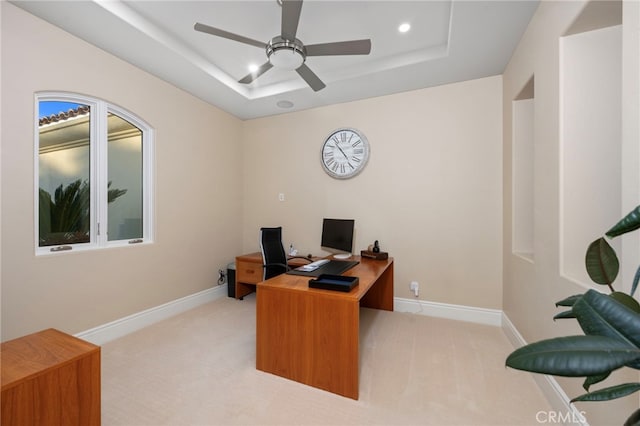 carpeted home office featuring a tray ceiling, a ceiling fan, baseboards, and recessed lighting