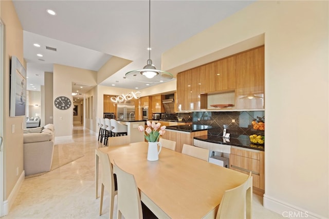 dining room featuring baseboards, visible vents, and recessed lighting
