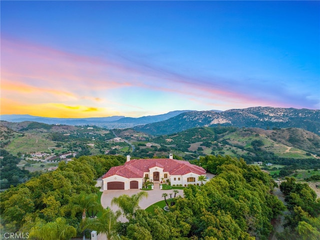 aerial view at dusk with a mountain view
