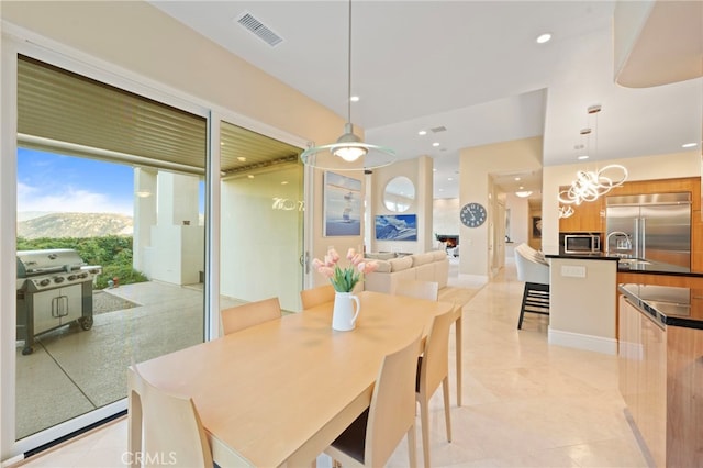 dining room featuring recessed lighting, a mountain view, visible vents, and light tile patterned floors