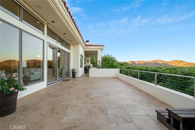 balcony featuring a mountain view