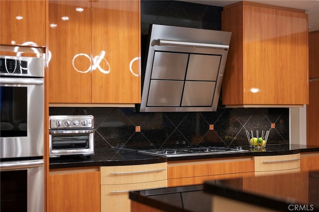 kitchen with backsplash, dark countertops, and appliances with stainless steel finishes