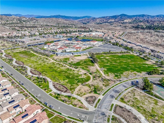 drone / aerial view featuring a residential view and a mountain view