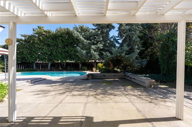 view of swimming pool with a pergola and a patio area