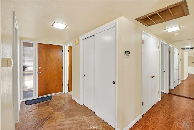 hall with light hardwood / wood-style flooring