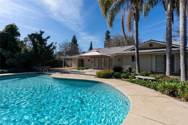 view of swimming pool featuring a pergola and a patio