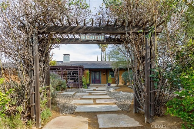 view of front of property with a pergola