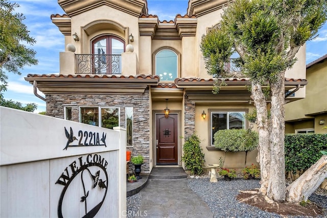 view of exterior entry featuring french doors