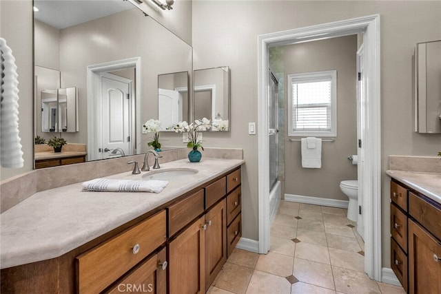 full bathroom with enclosed tub / shower combo, vanity, toilet, and tile patterned floors