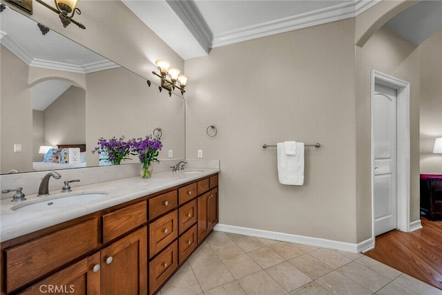 bathroom featuring crown molding, vanity, and tile patterned flooring