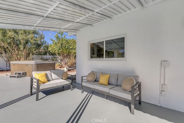 view of patio with an outdoor hangout area, fence, and a hot tub