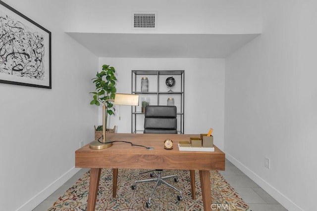 tiled home office featuring baseboards and visible vents