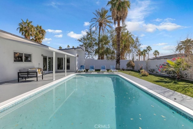 view of pool with a fenced in pool, a patio, and a fenced backyard