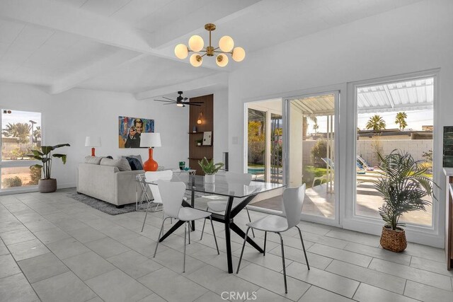 dining space with light tile patterned floors, beamed ceiling, and ceiling fan with notable chandelier