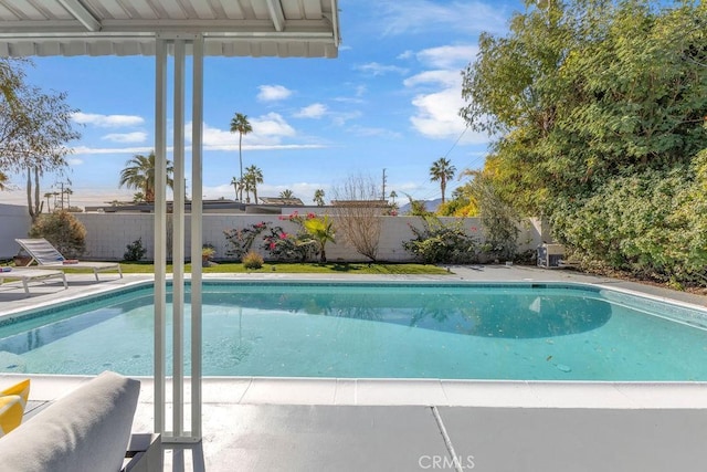 view of pool featuring a patio area, a fenced in pool, and a fenced backyard