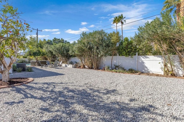 view of yard featuring a patio and fence