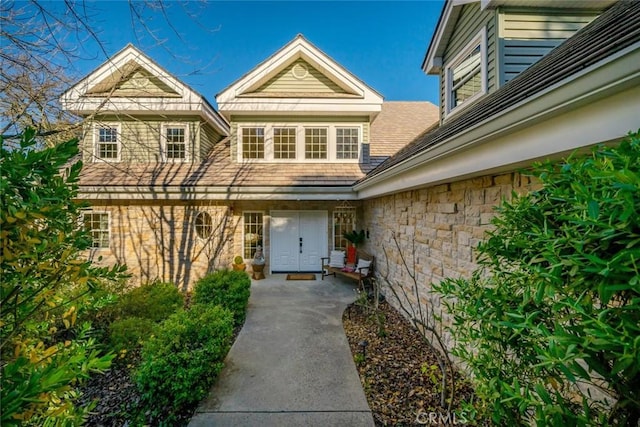 entrance to property with stone siding