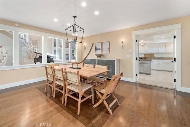 dining area featuring stairs, recessed lighting, wood finished floors, and baseboards