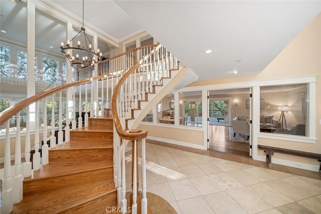 tiled entryway with a chandelier, stairway, recessed lighting, and baseboards