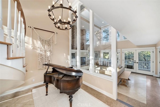 bathroom featuring a notable chandelier, visible vents, baseboards, french doors, and tile patterned floors