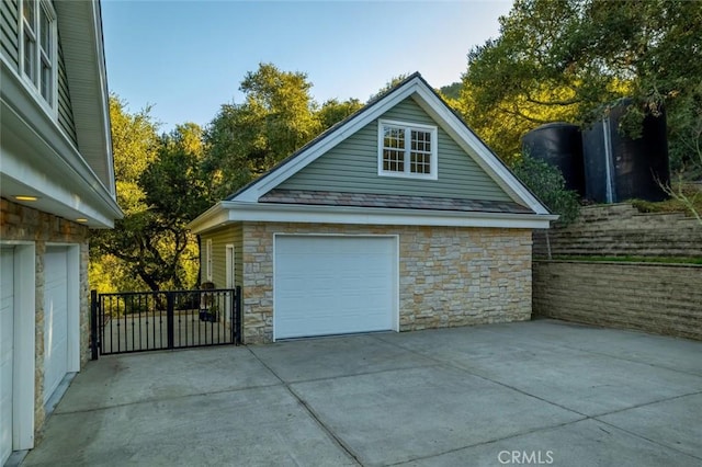 detached garage featuring driveway