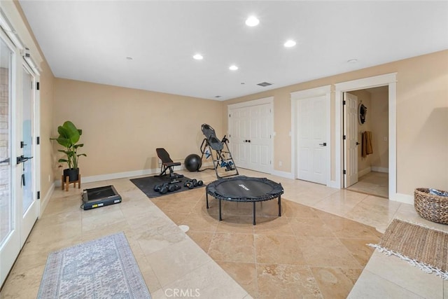 exercise room featuring recessed lighting, visible vents, and baseboards