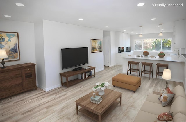 living room featuring sink and light wood-type flooring