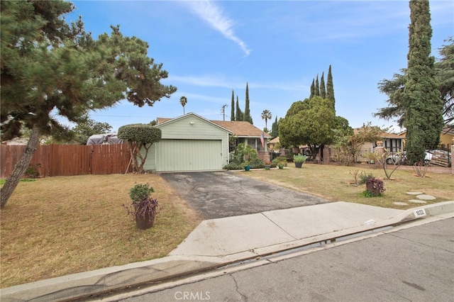 view of front of home with a garage and a front lawn