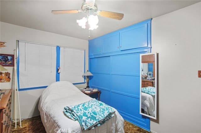 bedroom with ceiling fan and a closet