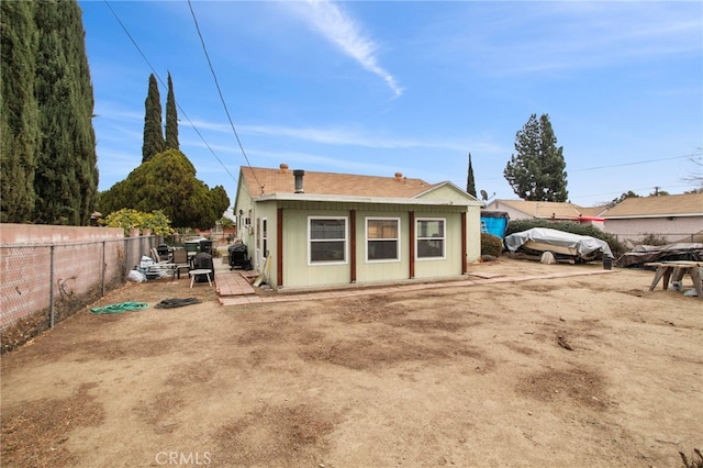 back of property with a patio area