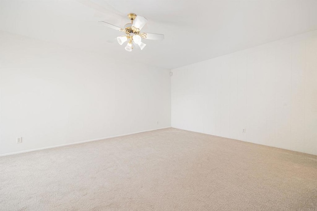 spare room with carpet flooring and ceiling fan