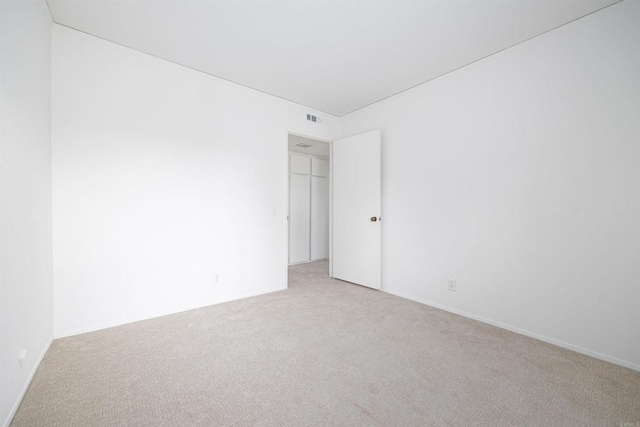 spare room with light carpet