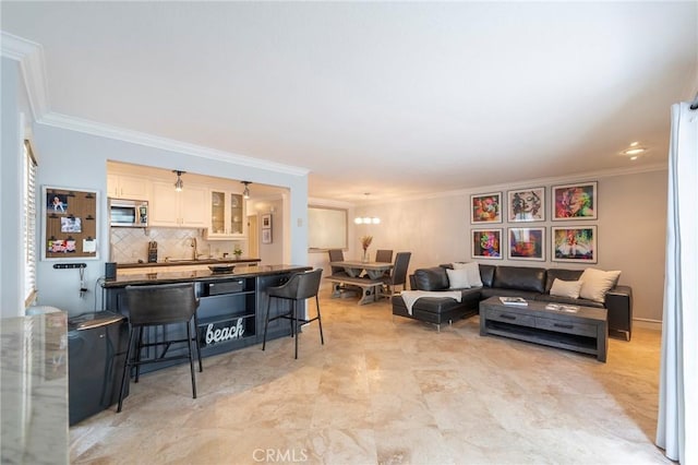 711 Pacific Coast Unit 313, Huntington Beach, CA 92648 - living room featuring ornamental molding