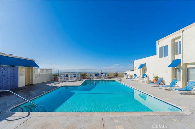 711 Pacific Coast Unit 313, Huntington Beach, CA 92648 - community pool featuring a patio